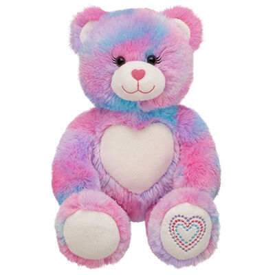 A forma e o bicho de pelúcia cor-de-rosa do urso de peluche brincam o material macio da forma