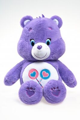 O cuidado original carrega brinquedos do luxuoso dos desenhos animados dos bichos de pelúcia, roxo/azul/amarelo