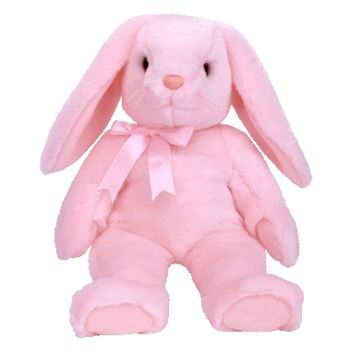 O impulso enchido roxo dos coelhinhos da Páscoa brinca bichos de pelúcia macios do feriado